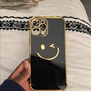 Black and Gold iPhone Pro Max Case with Smiley Design